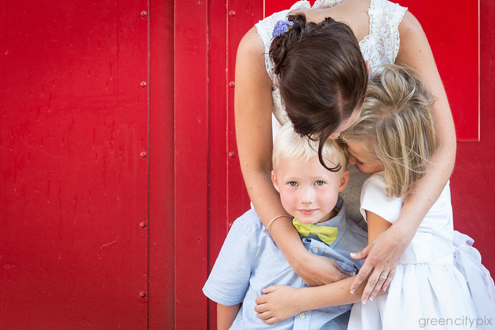 bride embracing children