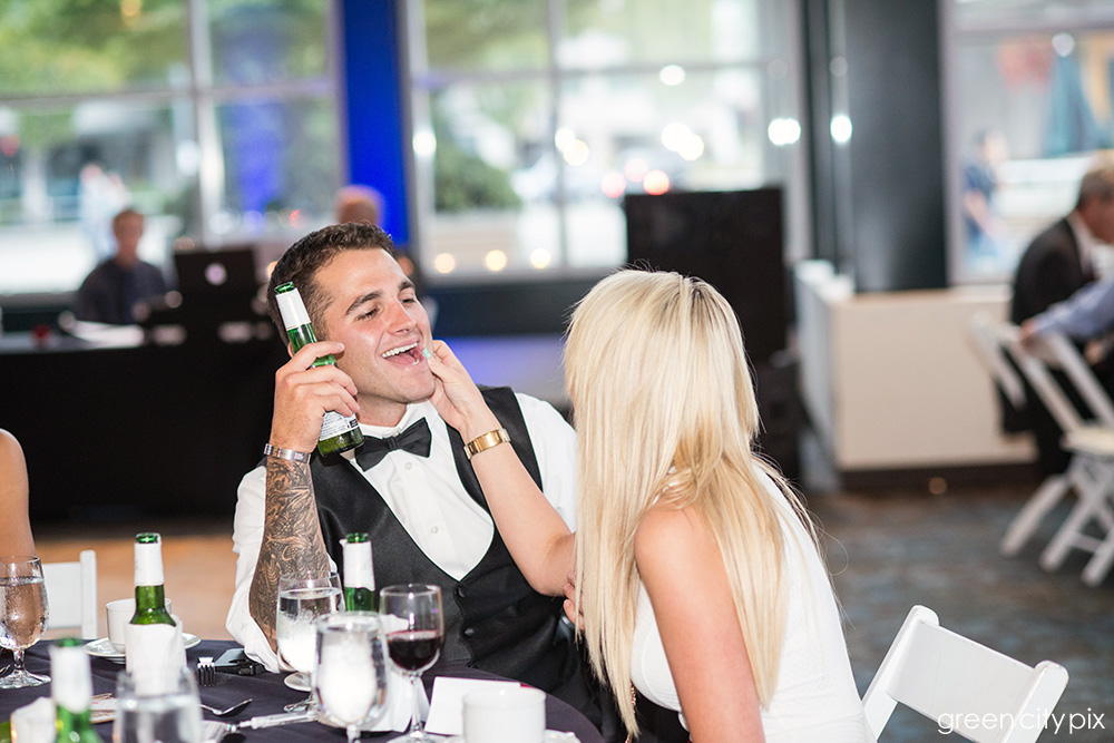 groomsman smiling at girlfriend