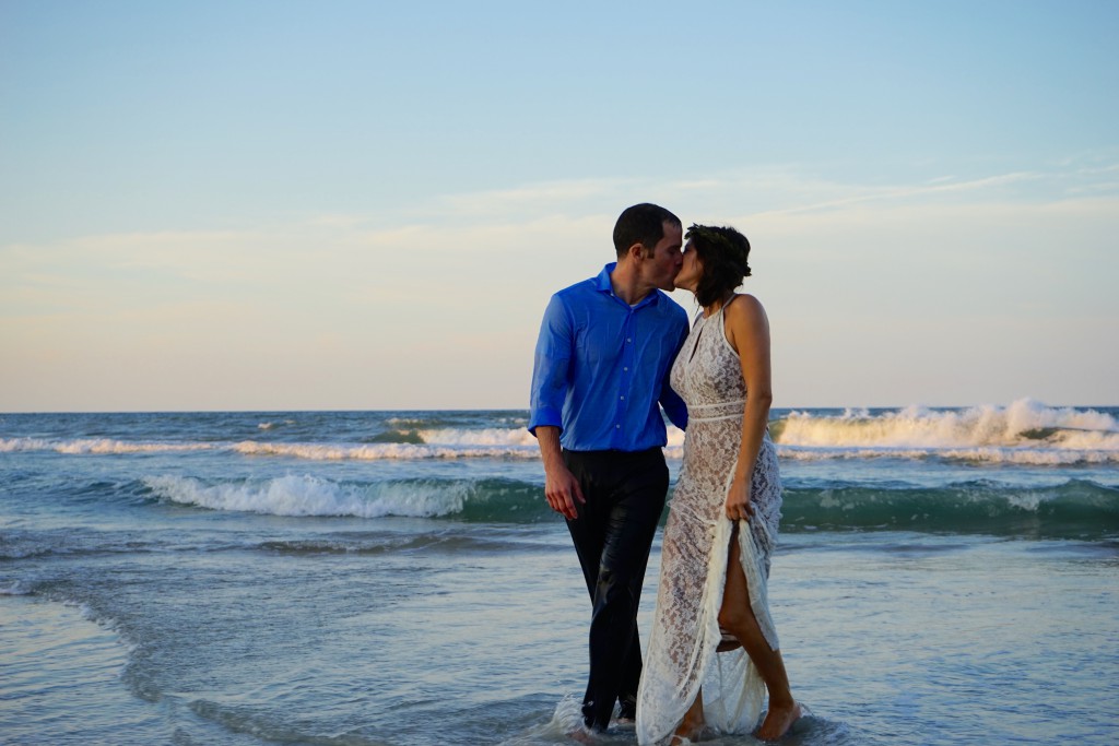 newlywed kiss on the beach