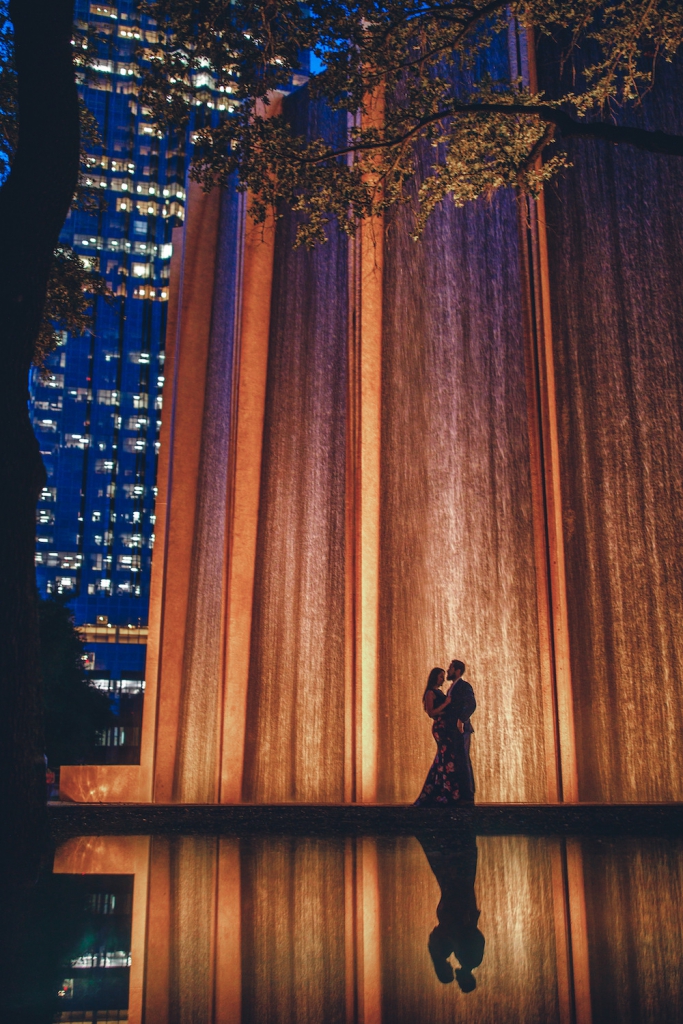 couple embracing at gerald D. hines waterwall park