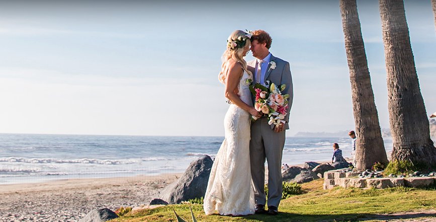 bride and groom embracing on wedding day at l'auberge del mar in san diego