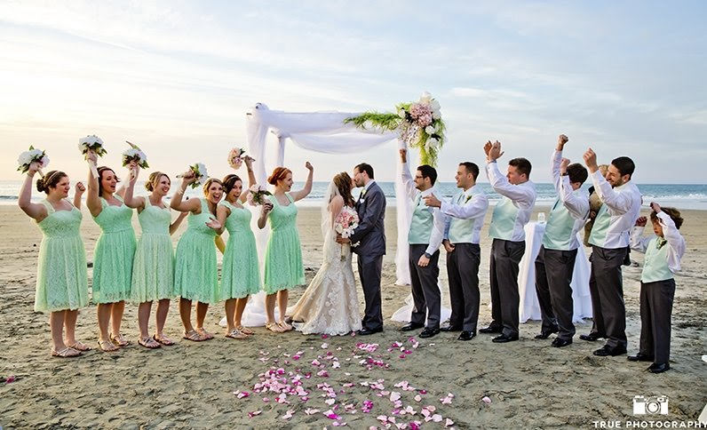 bride, groom, and wedding party on the beach at la jolla shores hotel in san diego