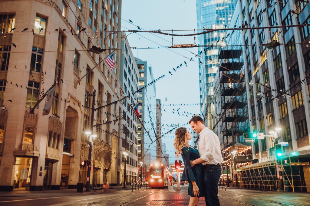 couple embracing on main street in houston