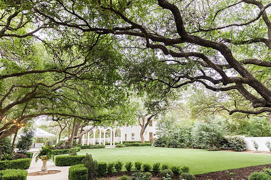 green, manicured shrubbery and centurion oaks at The Gardens at West Green wedding venue in San Antonio