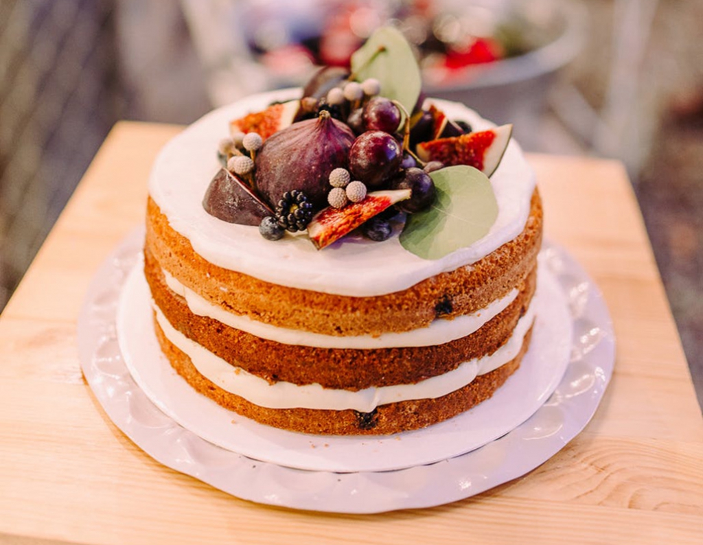 Naked wedding cake with figs and berries