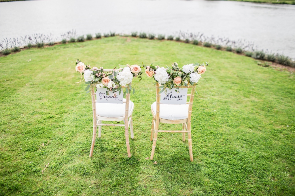 two wedding chairs labeled 