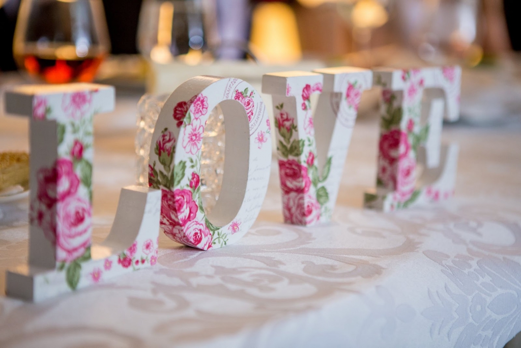 Floral wood block letters spelling out the word Love
