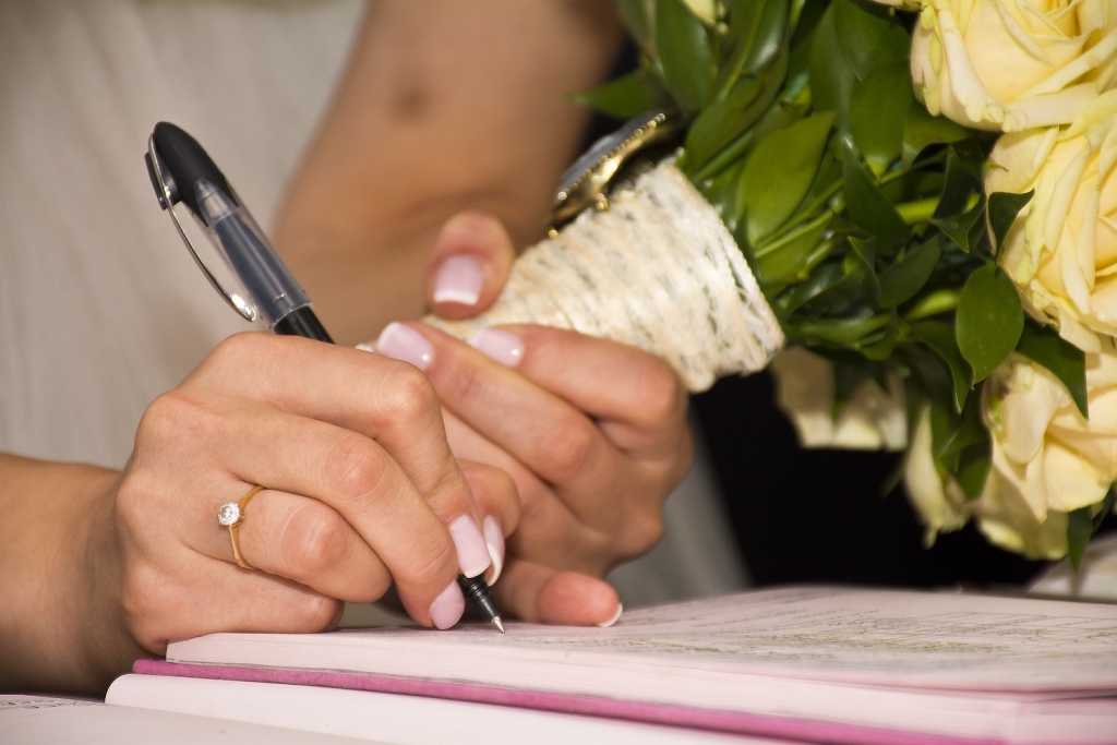 married woman writing on paper