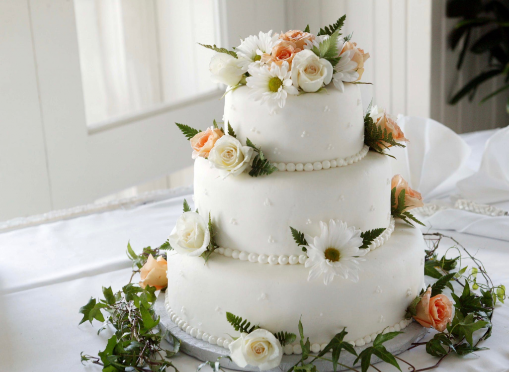 Wedding cake with peach flowers