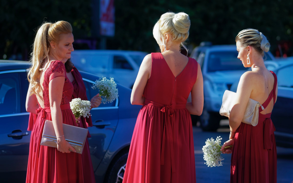 Bridesmaids in deep red dresses