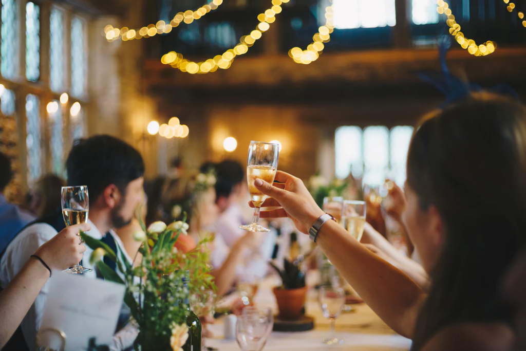 Guests raising a glass to toast 